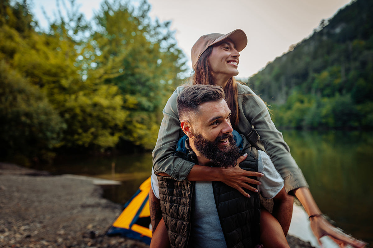 Couple having fun camping outdoors